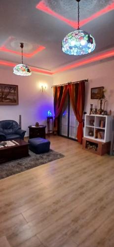 a living room with two lights on the ceiling at Blue ocean villa in Asilah