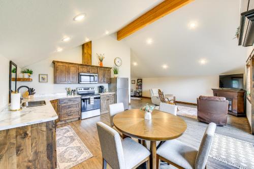 a kitchen and dining room with a table and chairs at Mtn and River-View Gem with Balcony in Bonners Ferry in Bonners Ferry