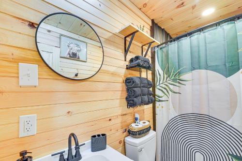 a bathroom with a shower and a sink and a mirror at Hot Tub, Fire Pit Lake-View Catlettsburg Getaway! in Catlettsburg
