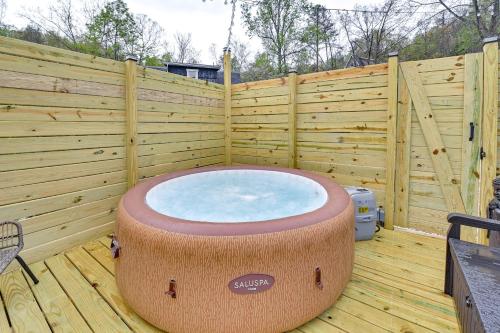 a large hot tub sitting on a wooden deck at Hot Tub, Fire Pit Lake-View Catlettsburg Getaway! in Catlettsburg
