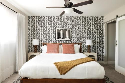 a bedroom with a large bed with a ceiling fan at 3BR Southwest Modern Haven - Old Town in Scottsdale