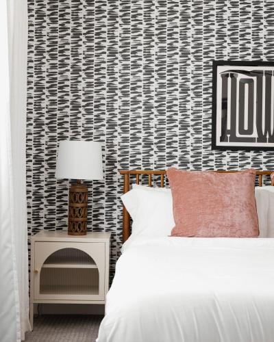a bedroom with a bed and a fire place at 3BR Southwest Modern Haven - Old Town in Scottsdale