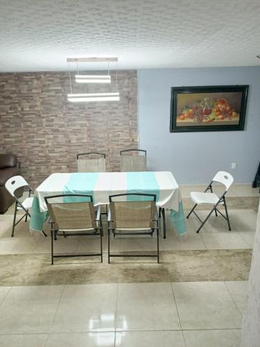 a dining room with a table and chairs at Luxos Casa Residencial Privada in San Miguel Contla