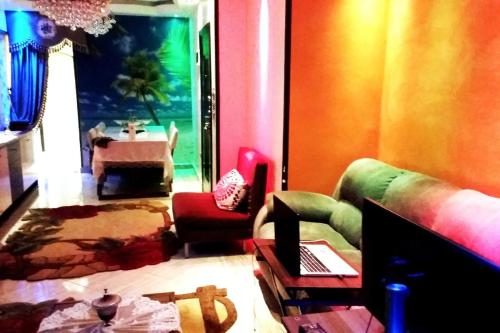 a living room with a couch and a table at Private Room In Apartment with Sea & Hilton View in Alexandria