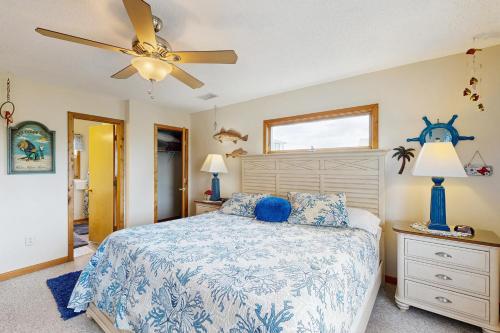 a bedroom with a bed and a ceiling fan at Lori's Lair #5-7 in Avon