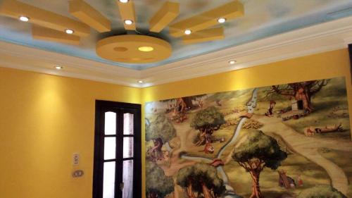 a mural on a wall in a room at Private Room In Apartment with Sea & Hilton View in Alexandria