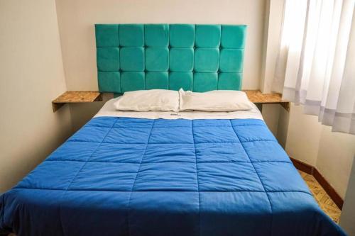 Ένα ή περισσότερα κρεβάτια σε δωμάτιο στο Inka Walker Hostel