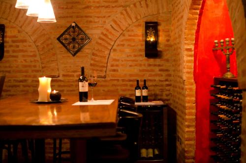 a wine tasting room with a table and wine bottles at Miravida Soho Hotel & Wine Bar in Buenos Aires