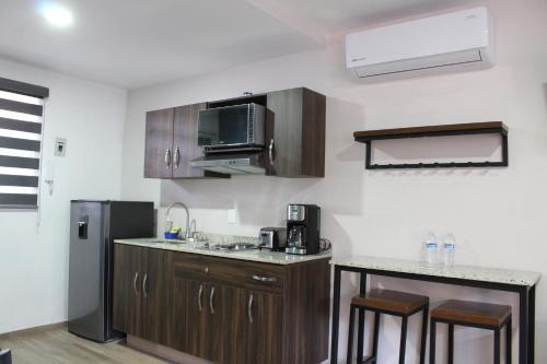 Η κουζίνα ή μικρή κουζίνα στο Lofts Las Fuentes