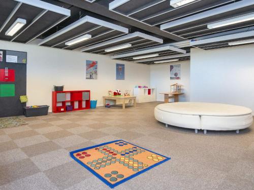 a large room with a couch and a table at 6 person holiday home on a holiday park in Fanø in Fanø