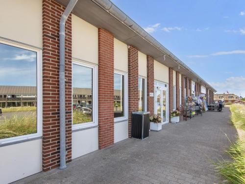 a row of windows on a brick building at 6 person holiday home on a holiday park in Fanø in Fanø