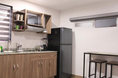 Η κουζίνα ή μικρή κουζίνα στο Lofts Las Fuentes