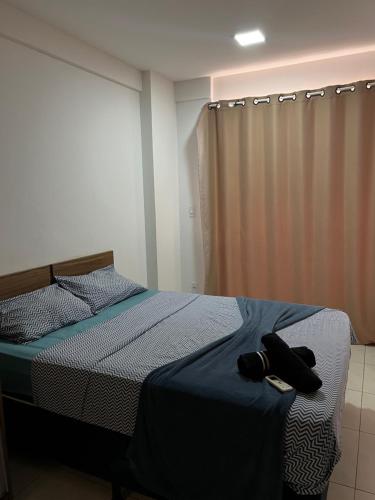 En eller flere senge i et værelse på Flat alto padrão na melhor localização da cidade