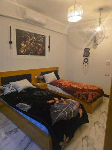Ένα ή περισσότερα κρεβάτια σε δωμάτιο στο Flower of life guest house