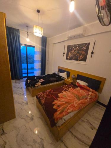 Ένα ή περισσότερα κρεβάτια σε δωμάτιο στο Flower of life guest house