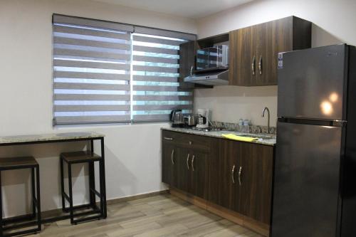 Η κουζίνα ή μικρή κουζίνα στο Lofts Las Fuentes