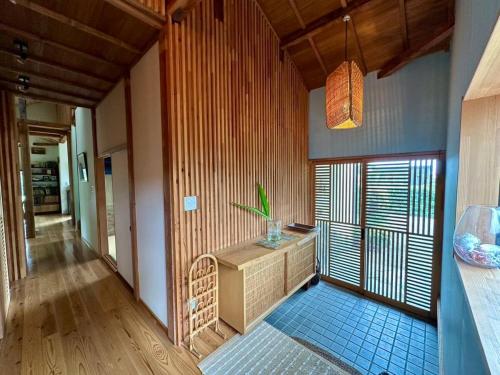 a room with a sink and a window in it at villa EDEN-Minamiboso- in Minamiboso