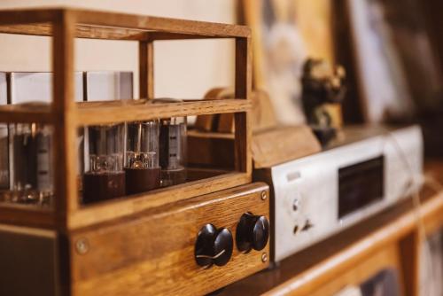 a wooden cabinet with a glass door with aether at Lodge Jotenki in Kiso