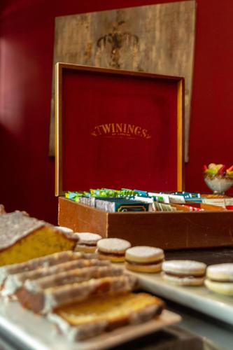 a table with cookies and a box of winnieiculty at Miravida Soho Hotel & Wine Bar in Buenos Aires