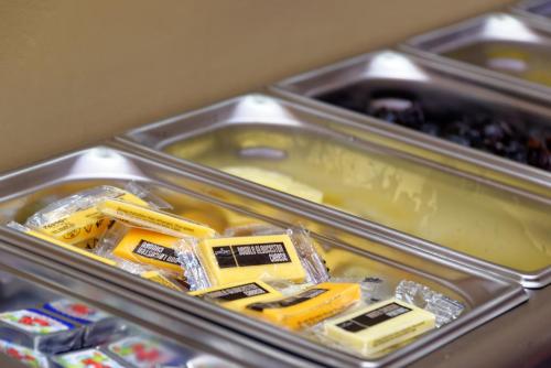 a metal container filled with yellow bulldozers on display at Grainger Hotel in Newcastle upon Tyne