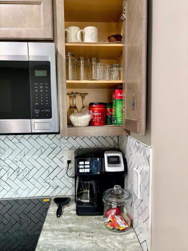 a kitchen with a counter top with a microwave at Nice and cozy whole house 25min to Niagara falls in Buffalo