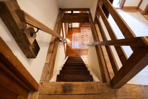 an overhead view of a staircase with wooden beams at Osceola Mill in Raphine