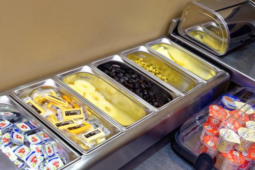 a food cart with some trays of food at Grainger Hotel in Newcastle upon Tyne