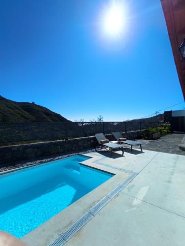 a swimming pool on the side of a building at Natura Luxury in Las Lagunetas