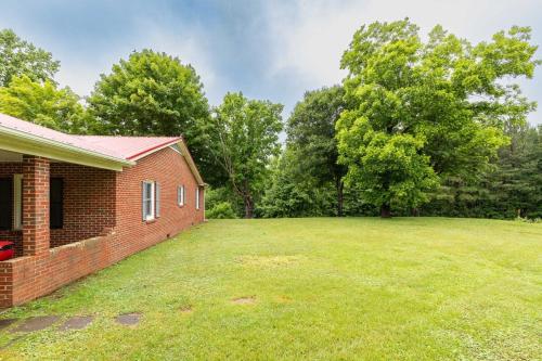 a brick house with a large yard at Red Robin Retreat - Near Lake James, NC in Morganton
