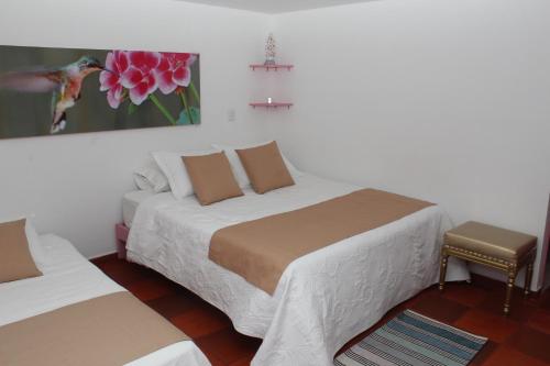 Postel nebo postele na pokoji v ubytování Hotel Balcón del Cielo