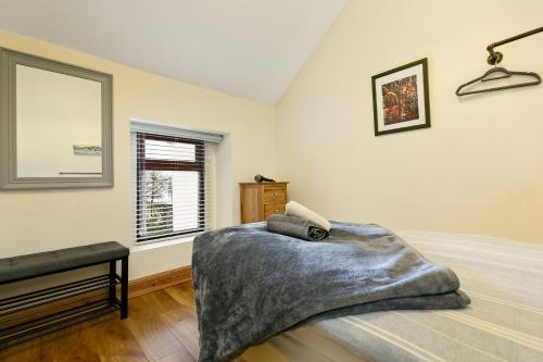 a bedroom with a bed with a blanket on it at Union Place in Sligo