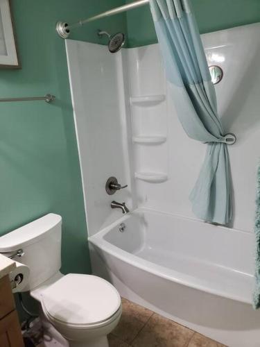 a bathroom with a toilet and a shower and a sink at Seas the day llc in Myrtle Beach