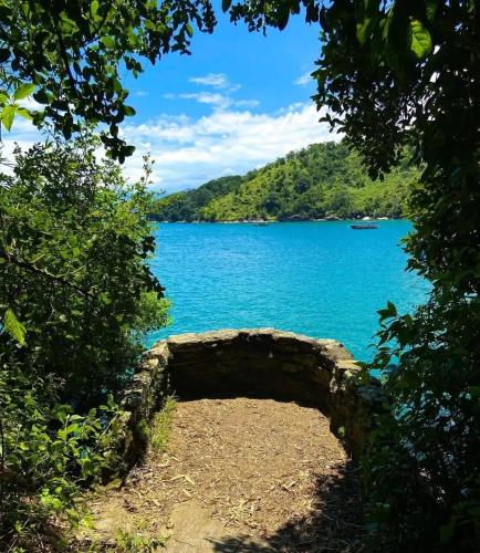 a view of a body of water with trees at Recanto Machado in Paraty