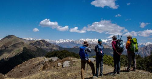 a group of people standing on top of a mountain at Jibhi Village in Jibhi