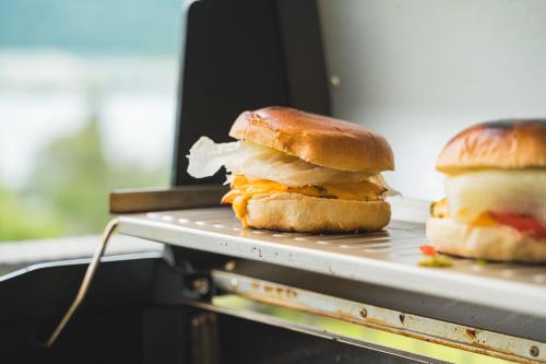 two sandwiches sitting on a tray on a table at TROPICAL ISLAND 23C - Seesicht - Massage - BBQ - Billiard - Tischkicker - Penthouse - Parkplatz in Öhningen