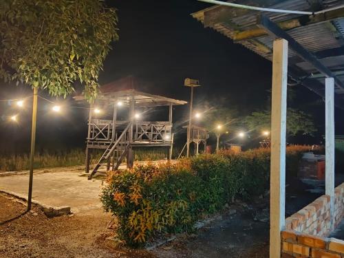 a night time view of a building with lights at Casa Villa Homestay Sekinchan in Sekincan