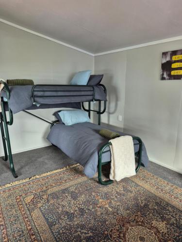 a bedroom with a bunk bed in a room at The rustic haven in Matangi