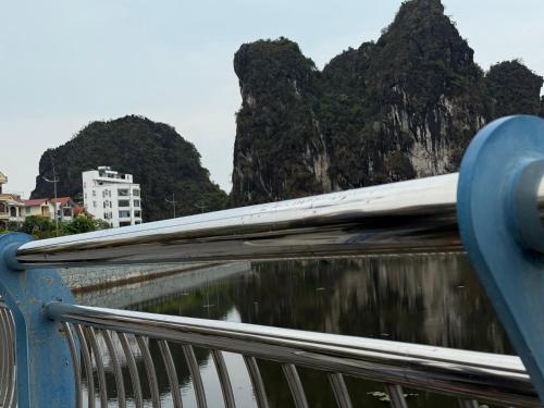 a view from a bridge with mountains in the background at Táo Homestay in Ha Long