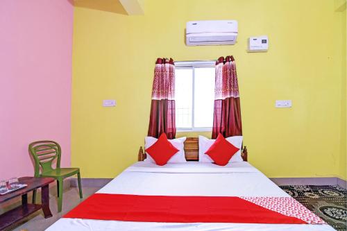 Postel nebo postele na pokoji v ubytování Hotel O Utkal Grand