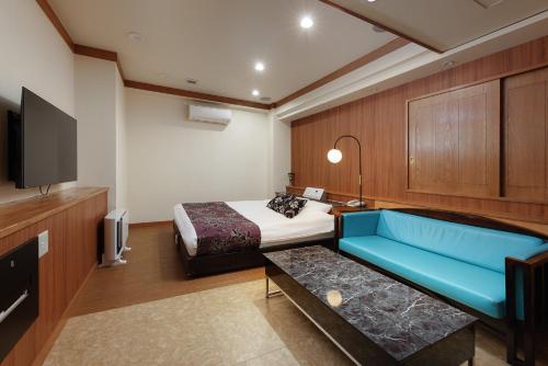 Ένα ή περισσότερα κρεβάτια σε δωμάτιο στο hotelzekumochimune