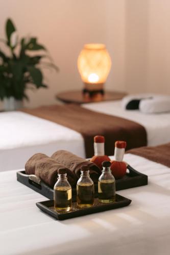 Ένα ή περισσότερα κρεβάτια σε δωμάτιο στο Choasis Hotel-Luang Prabang