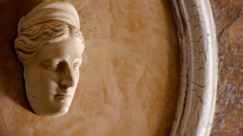 a statue of a head on a wall at Apollon Hotel in Ancient Epidavros