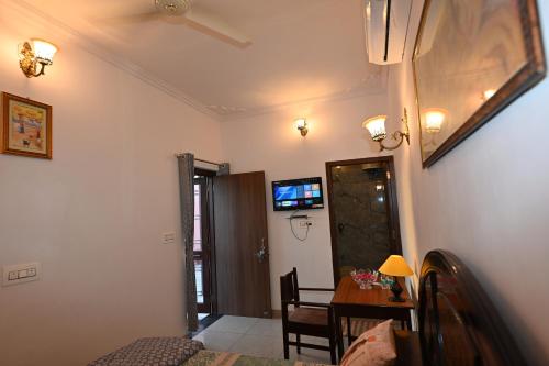 a room with a table and a dining room at Ardas Villa Bikaner - Heritage Luxury Boutique Stay in Bikaner