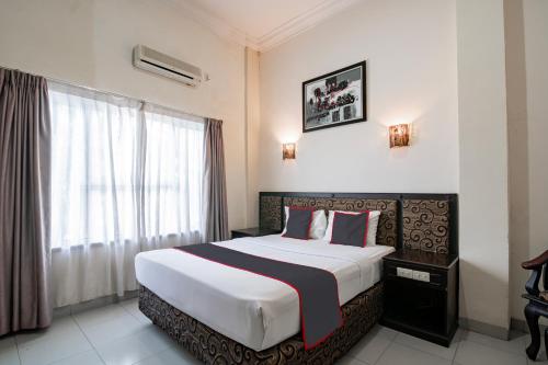 Ένα ή περισσότερα κρεβάτια σε δωμάτιο στο Hotel De Town 6 Hour Stay