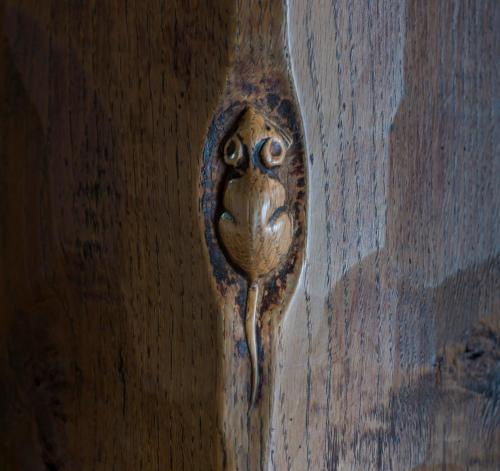 a bird carved into the side of a wooden wall at The Feathers Hotel, Helmsley, North Yorkshire - The Coaching Inn Group in Helmsley