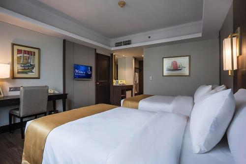 Ένα ή περισσότερα κρεβάτια σε δωμάτιο στο The Acacia Hotel Jakarta