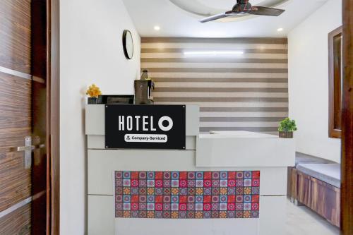 a hotel lobby with a sign on the wall at Super Hotel O Chandigarh Highway Near Prabhat Road in Zirakpur