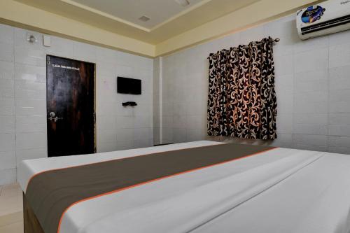 Cama o camas de una habitación en Hotel O Konark Inn