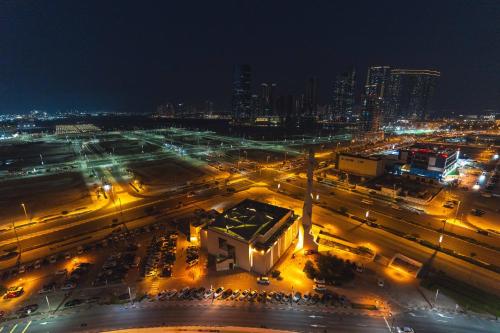 an aerial view of a city at night at Voyage Two Bedroom In Reem Island in Abu Dhabi