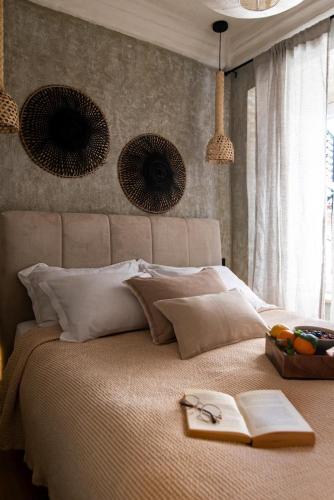 a bedroom with a bed with two books on it at Shanti Dubrovnik in Dubrovnik